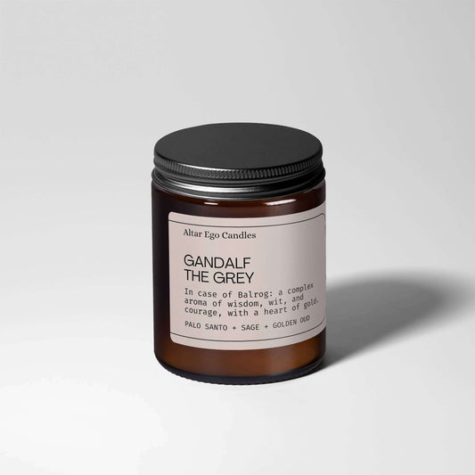 WoodWick Candle GANDALF THE GREY with notes of palo santo, sage, and golden oud in a stylish amber jar.