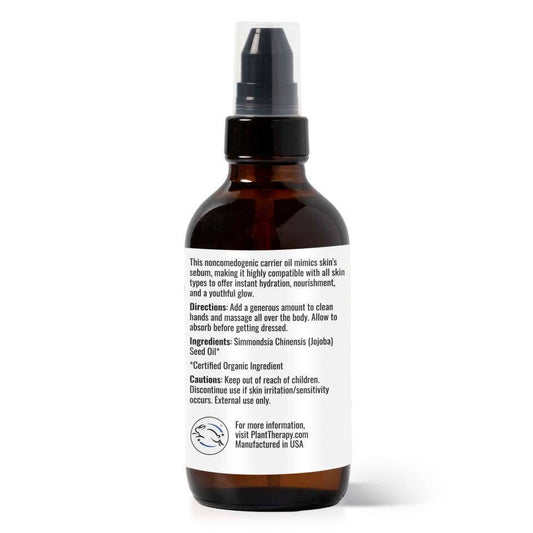 Organic Jojoba Oil bottle with directions and ingredients on label, promoting hydration and skin nourishment.