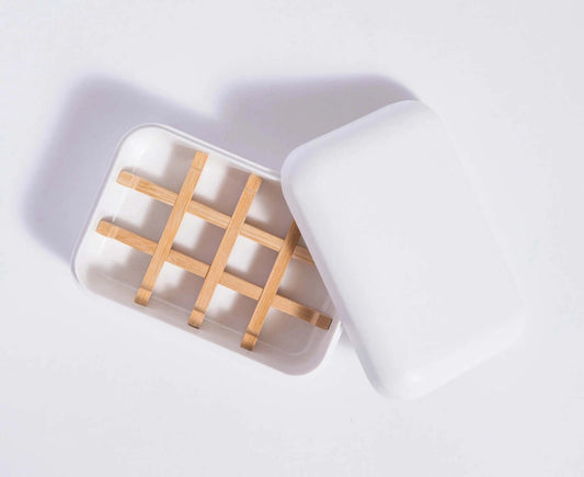 travel soap holder made from cornstarch with a bamboo holder inside