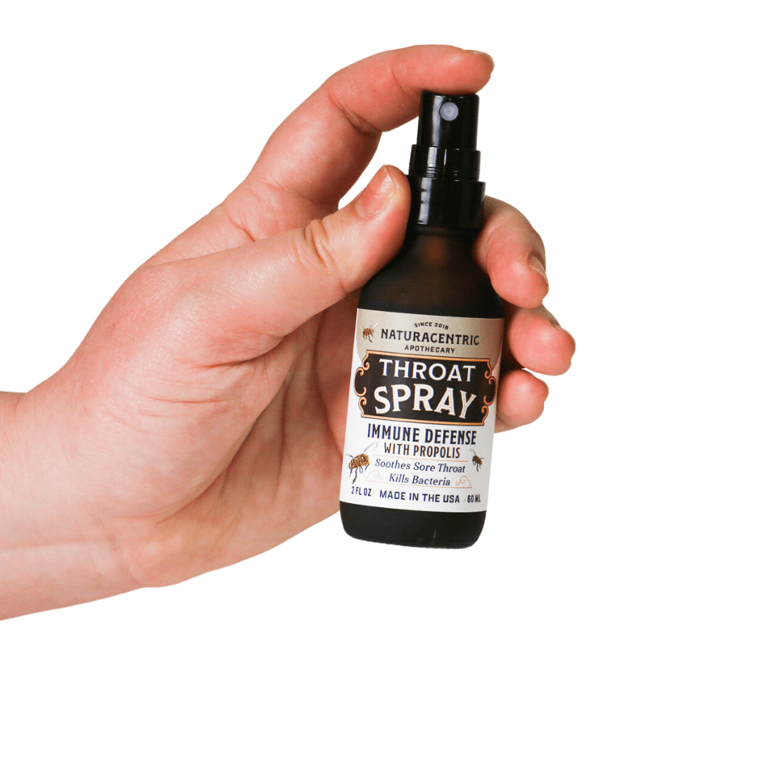 Immune Defense Throat Spray with Propolis & Honey in a hand-held spray bottle for soothing throat relief.