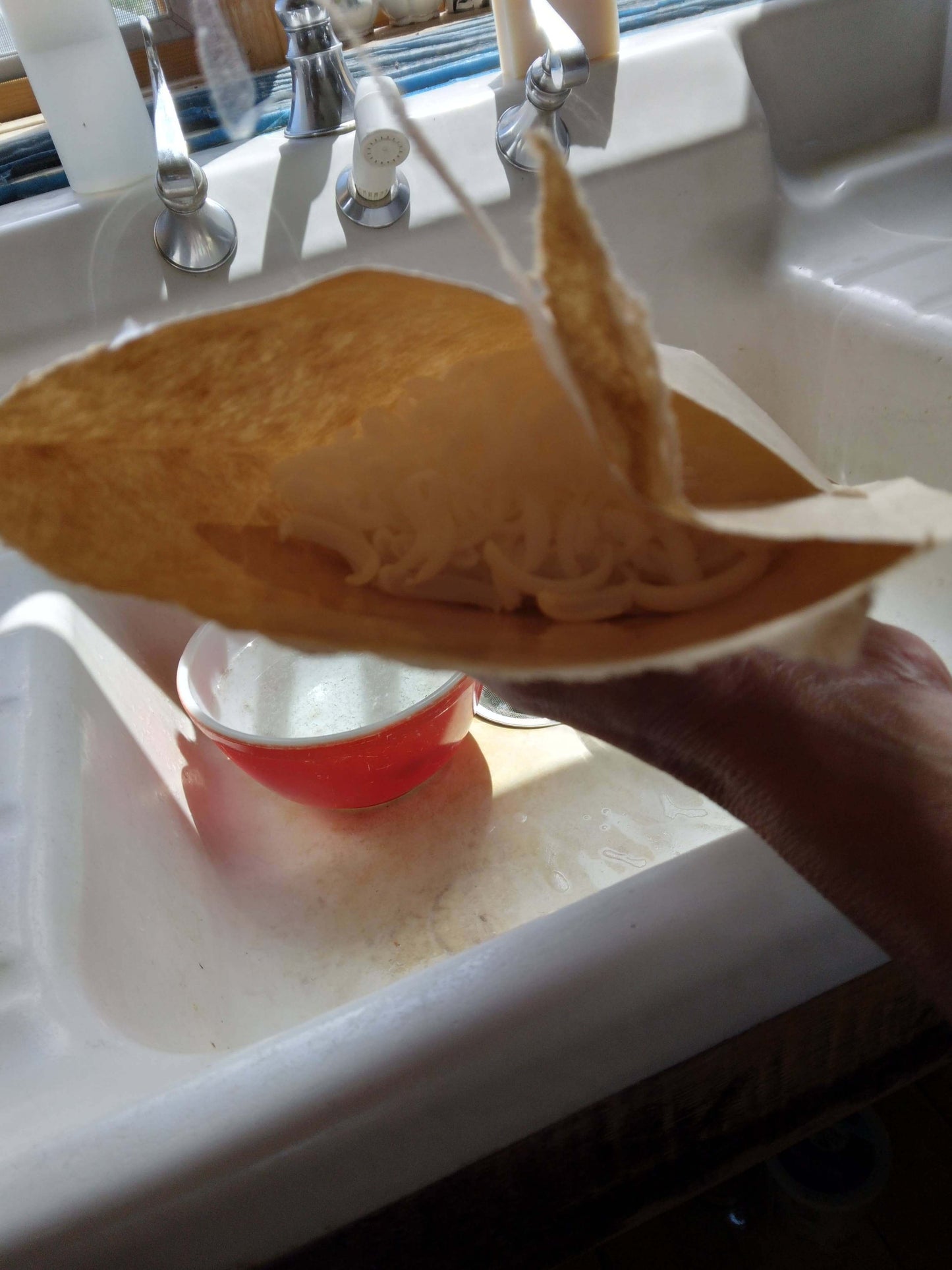 Pouring Instant Liquid Soap Refill Lemongrass into a bowl for easy mixing with water.