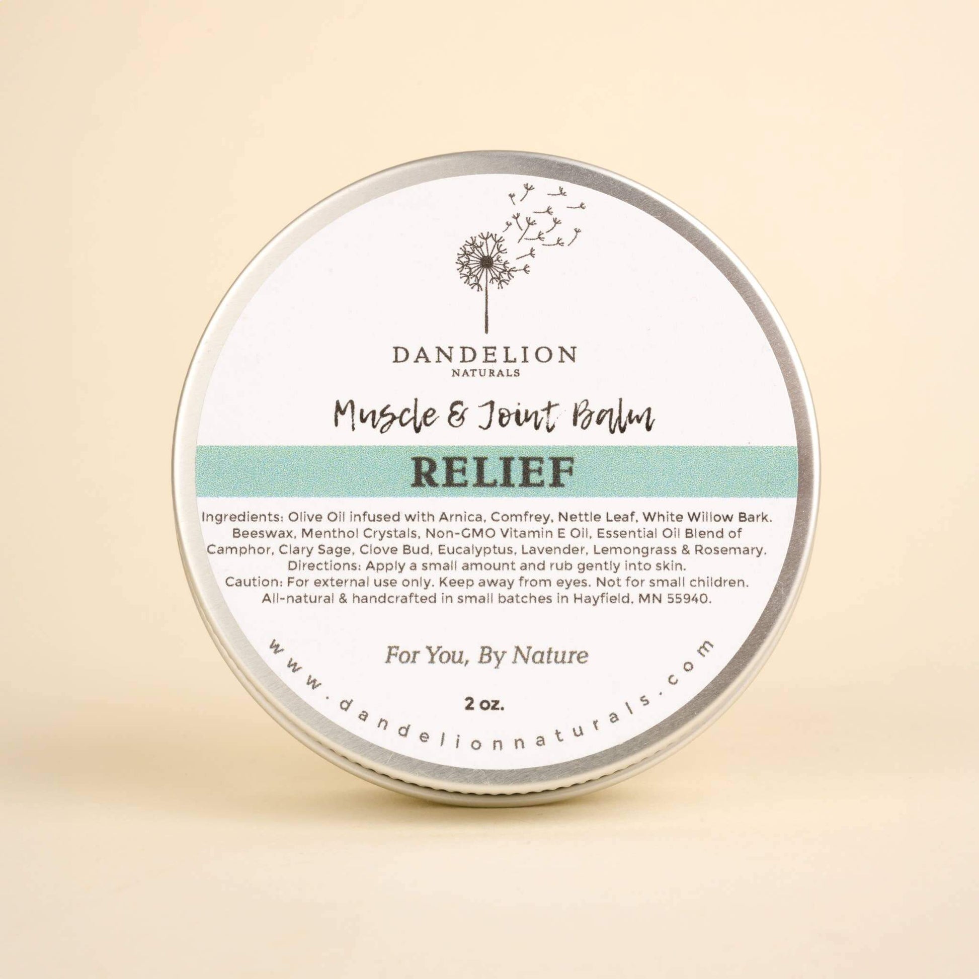 Natural muscle and joint balm by Dandelion Naturals, featuring arnica, for pain relief and inflammation reduction.
