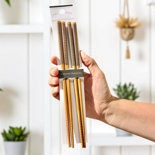 Bamboo Chopsticks Set | Holiday Stocking Stuffer: Black & Black displayed in hand, showcasing eco-friendly design.