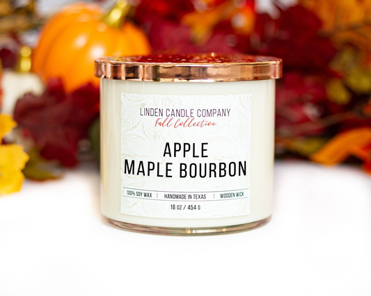Non toxic soy candle with wooden wick in apple maple bourbon scent.