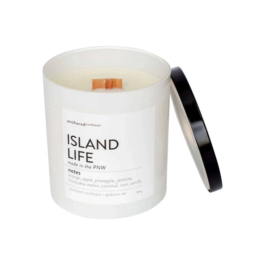 white glass, cedar wood wick, soy candle in island life scent