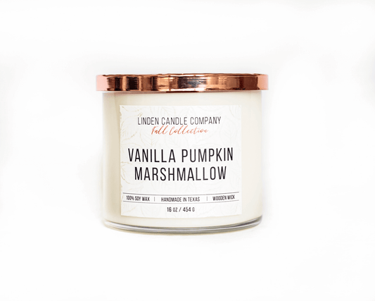 Natural soy candle in vanilla pumpkin marshmallow scent with a wood wick and copper lid.