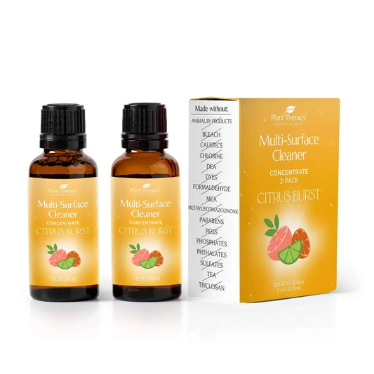 Citrus Burst Multi-Surface Cleaner 2-pack with cheerful citrus scent and essential oils in amber bottles.