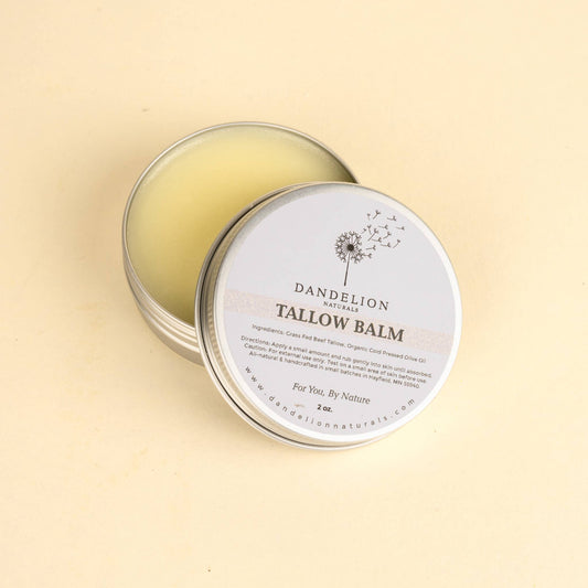 Dandelion Naturals Tallow Balm in a silver tin, ideal for moisturizing sensitive skin and healing eczema or psoriasis.
