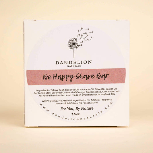 Dandelion Naturals Be Happy Shave Bar packaging with ingredients and promises for natural skincare.