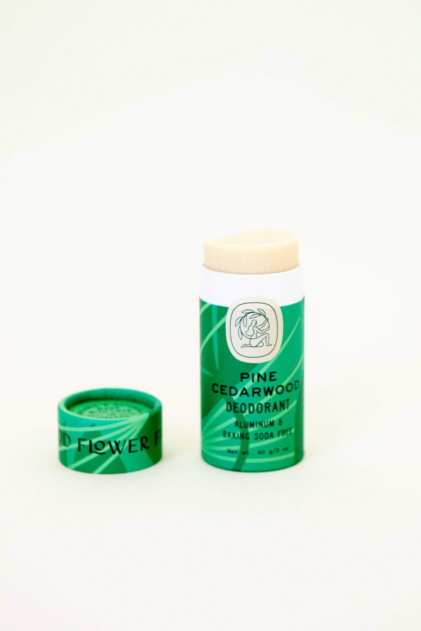 Non toxic deodorant in pine cedarwood scent  in a green biodegradable tube.