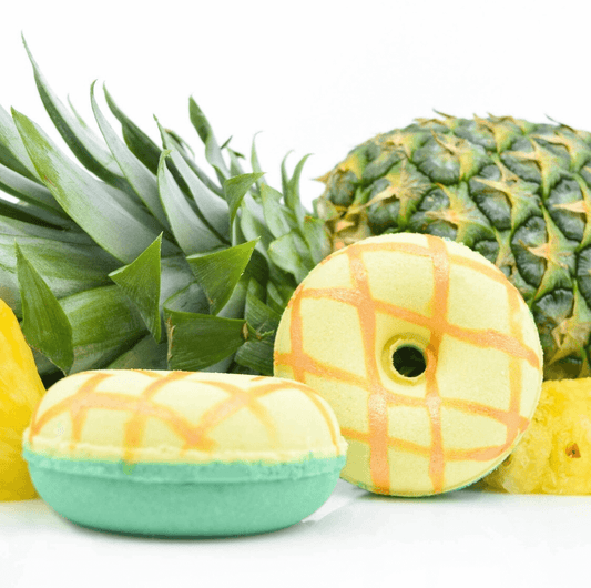 donut shaped bath bomb in pineapple scent with a pineapple