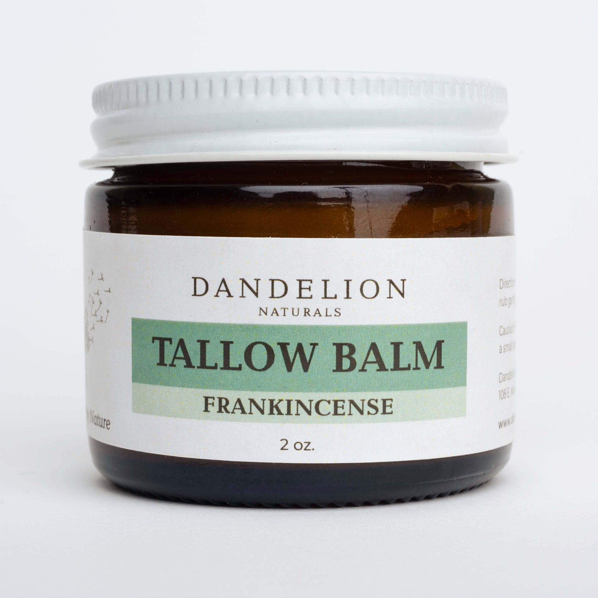 Amber jar of Dandelion Naturals Tallow Balm with Frankincense, 2 oz, for skin nourishment and hydration.