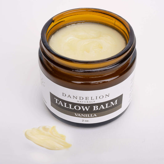 Grass-fed Tallow Balm in amber jar with vanilla scent, nourishing and hydrating skin.
