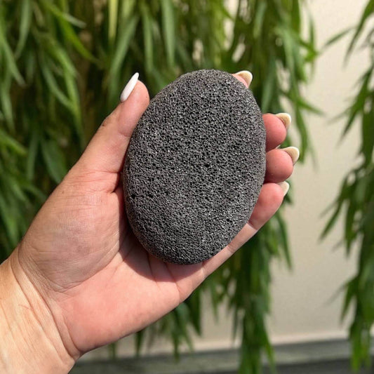 Large Natural Pumice Foot Stone | Christmas Gift Bestseller held in hand, perfect for removing calluses and smoothing feet.