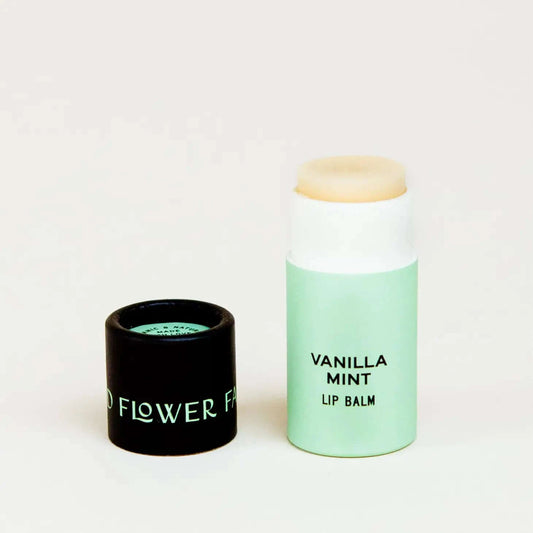 organic lip balm in vanilla mint, in a biodegradable tube with the lid off