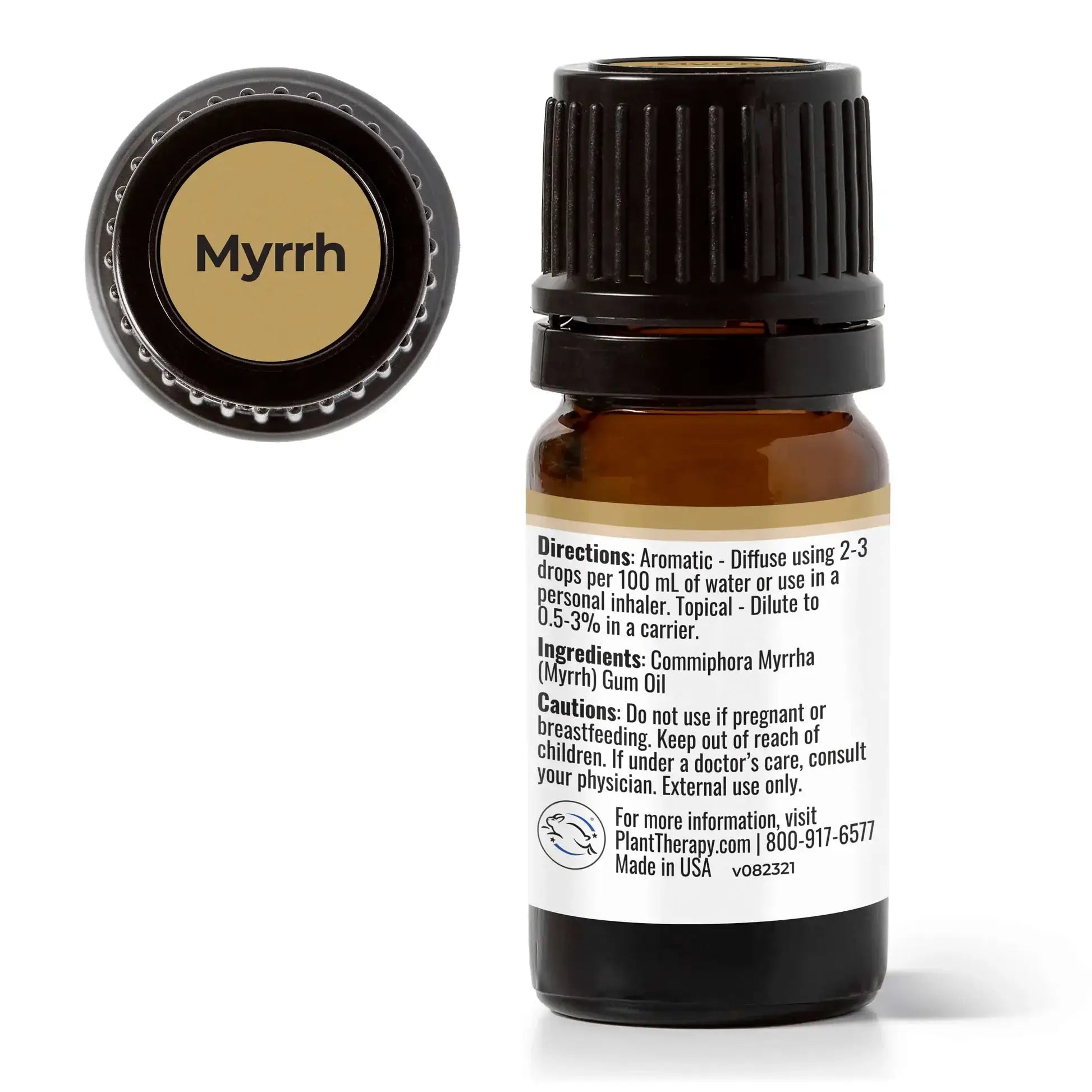 Bottle of Myrrh essential oil with black cap, label showing directions and ingredients for calming and grounding effects.