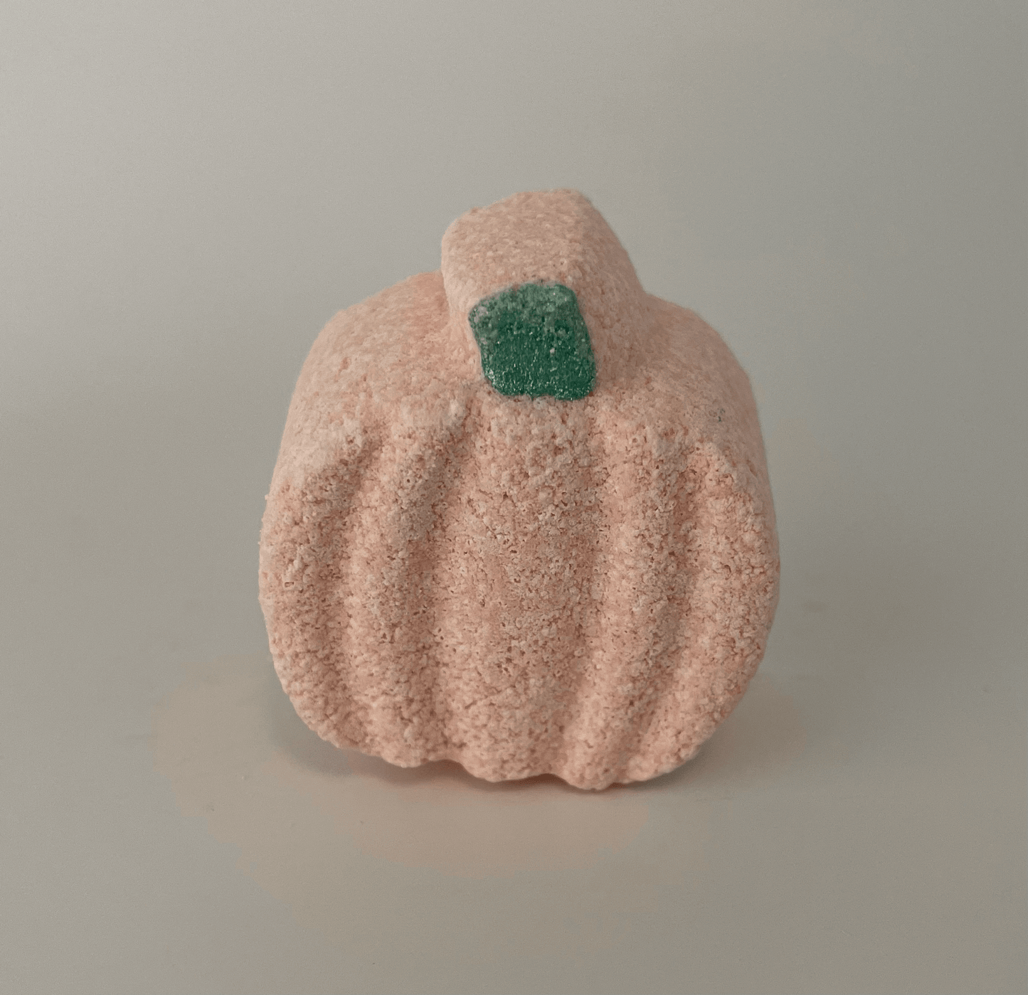 Natural mini pumpkin shaped bath bomb.