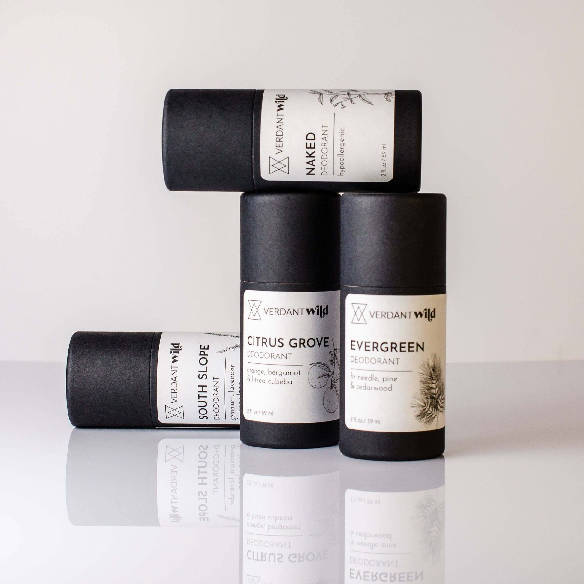 Non Toxic deodorants in a variety of scents in biodegradable tubes with white labels.
