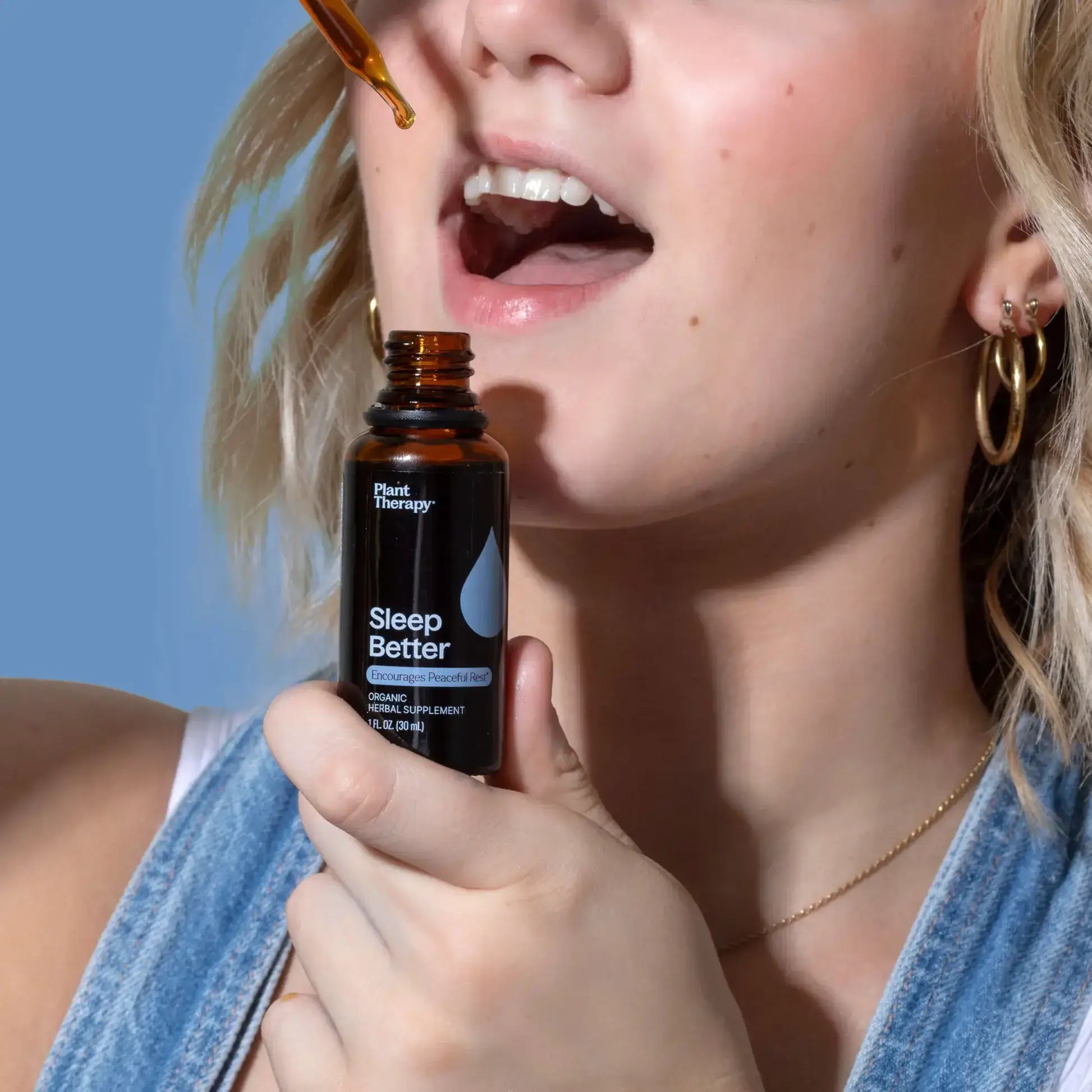 Organic Sleep Better Tincture 30 mL - Natural Supplements being applied for restful sleep.