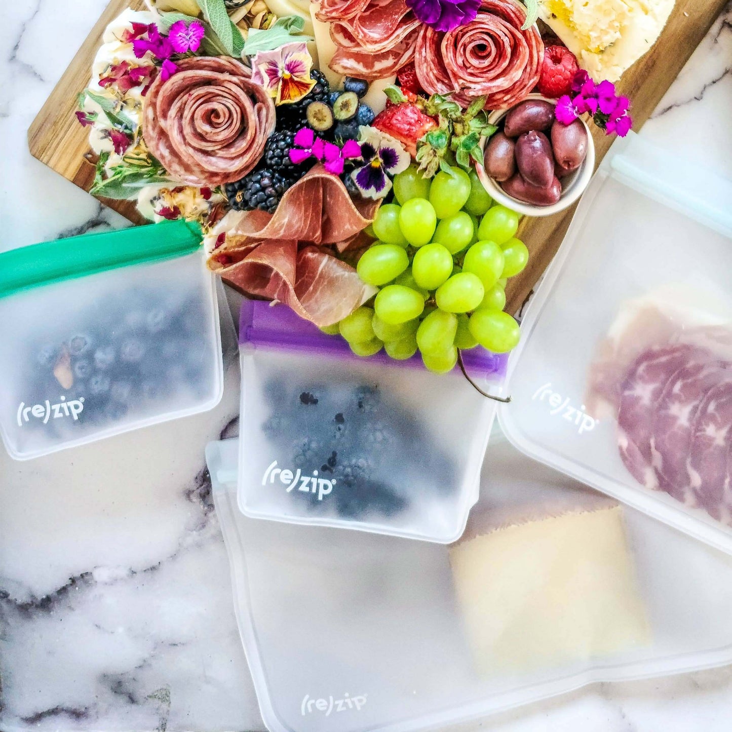 Reusable Stand-Up Storage Bags - Small - 5 Pc Set - Eco-Friendly with snacks and fruits on a wooden board.