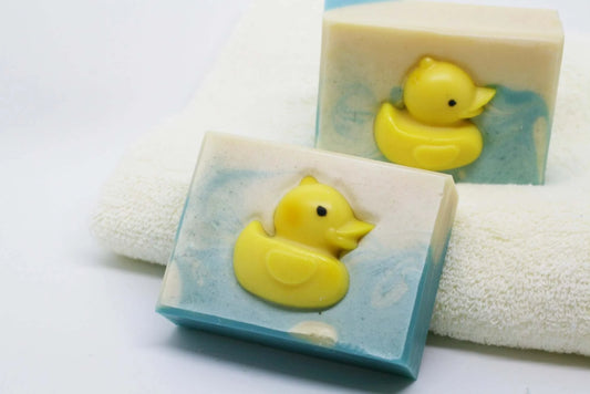 handmade, organic soap bar with a yellow rubber ducky soap inside