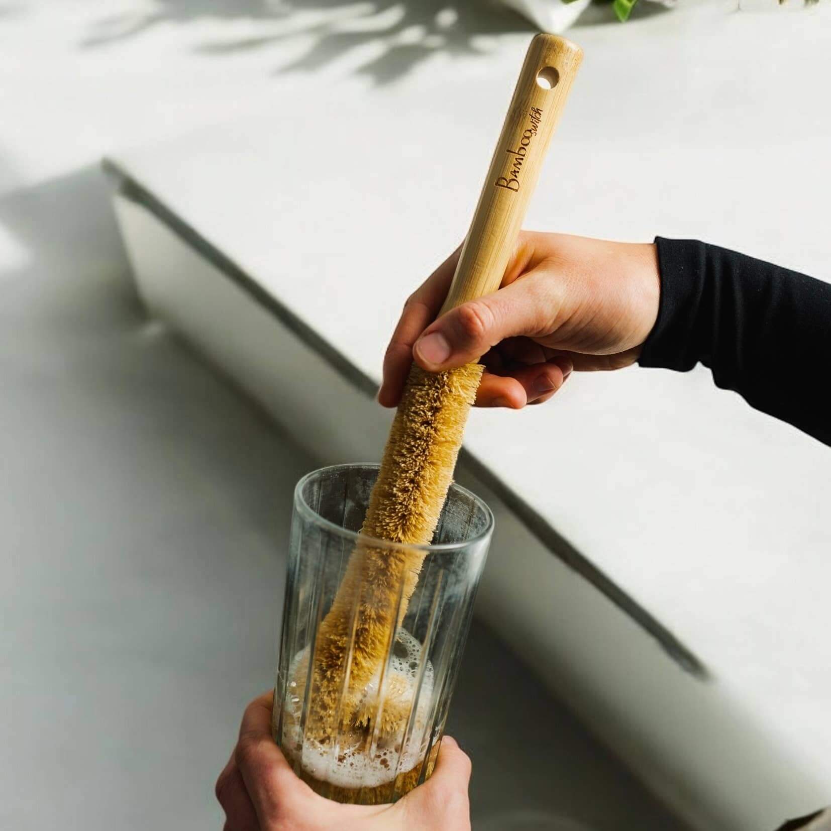 XL Natural Bottle Brush | Kitchen Bestseller being used to clean a glass, showcasing its eco-friendly design.